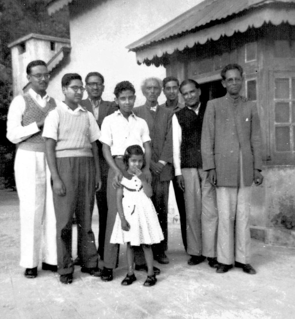 Anuradha Joshi as a young girl at Bappi's house, Fern Lodge, surrounded by her uncles. On the extreme right is her grandfather, Babban.