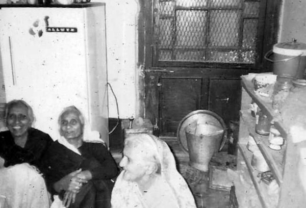 The kitchen at Bappi's house, Fern Lodge. Seated are Bappi's daughters (from L to R): Lakshmi Devi, Devaki Devi and Ganga Devi.