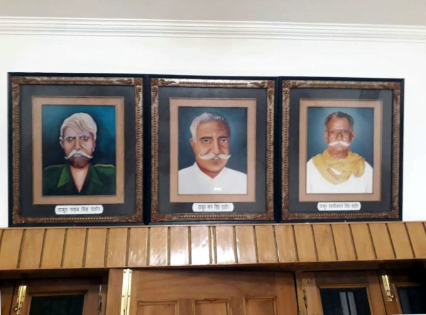 A portrait of Maan Singh, flanked by those of his sons, on the left, Subedar Singh and on the right, Tehsildar Singh.