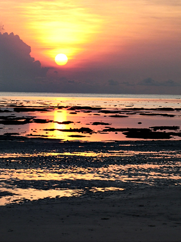 Sunset, setting sun on the beach at Havelock Island, photograph by Rajesh Vasavada.